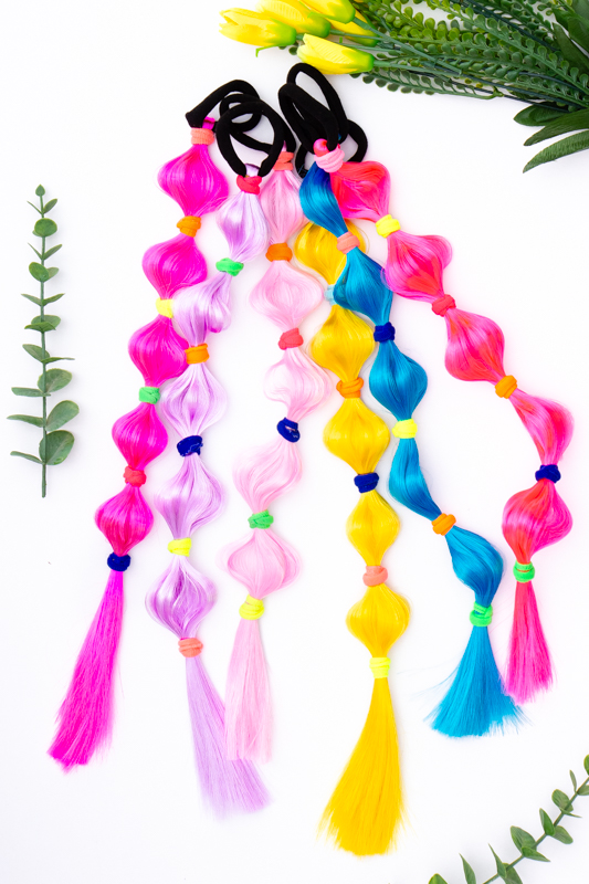 Коси зі штучного волосся на гумках